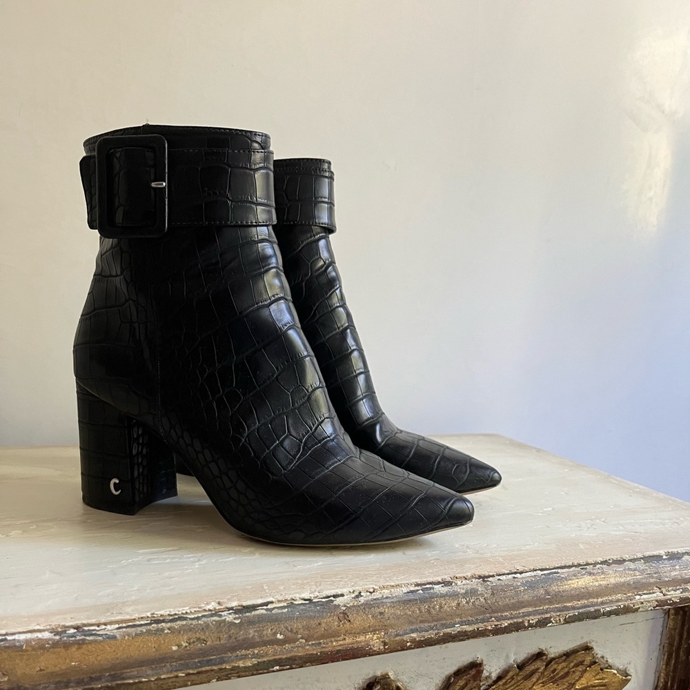 Black faux snakeskin heeled booties with thick buckle